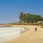 Lady walking along Ampenyi beach